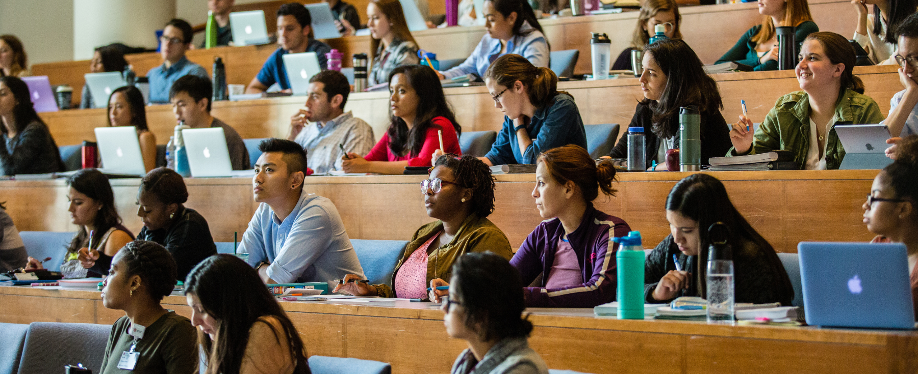 Students sitting in a lecture hall.